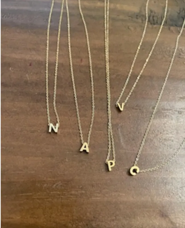 dainty initial sold by bubs & sass