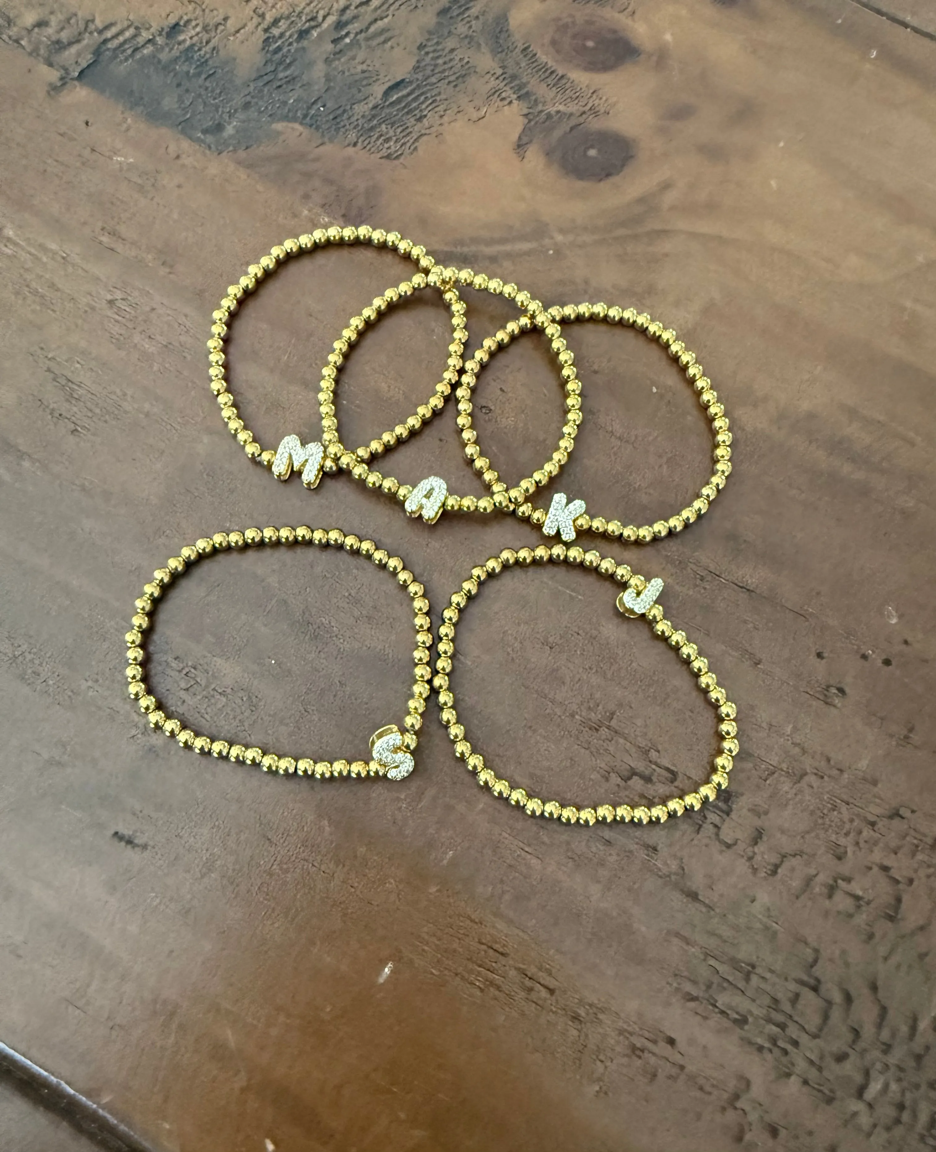 waterproof beaded initial bracelet sold by bubs & sass