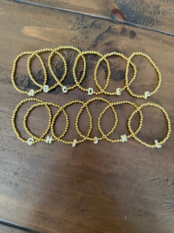 waterproof beaded initial bracelets sold by bubs & sass