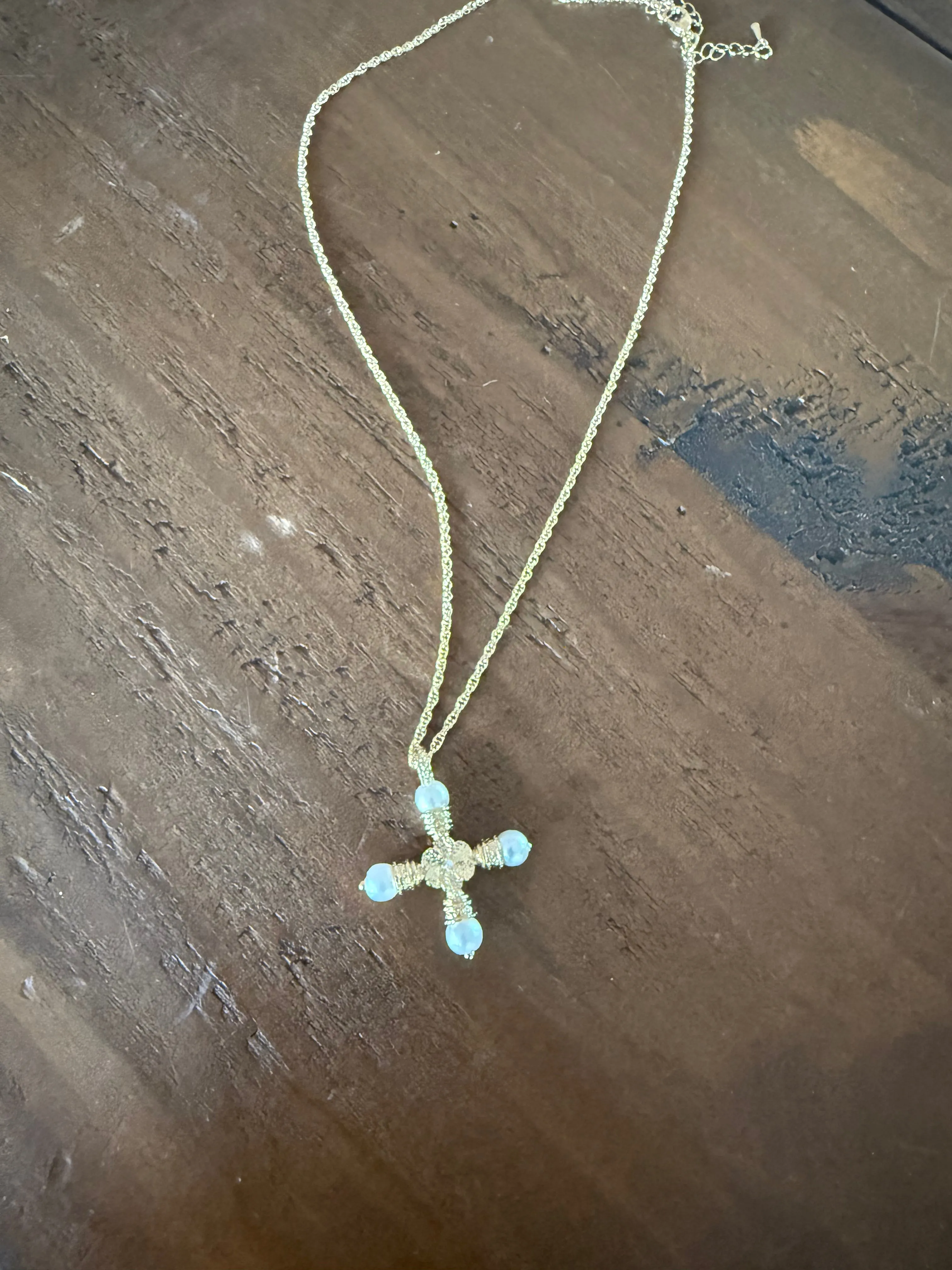 waterproof pearl cross sold by bubs & sass
