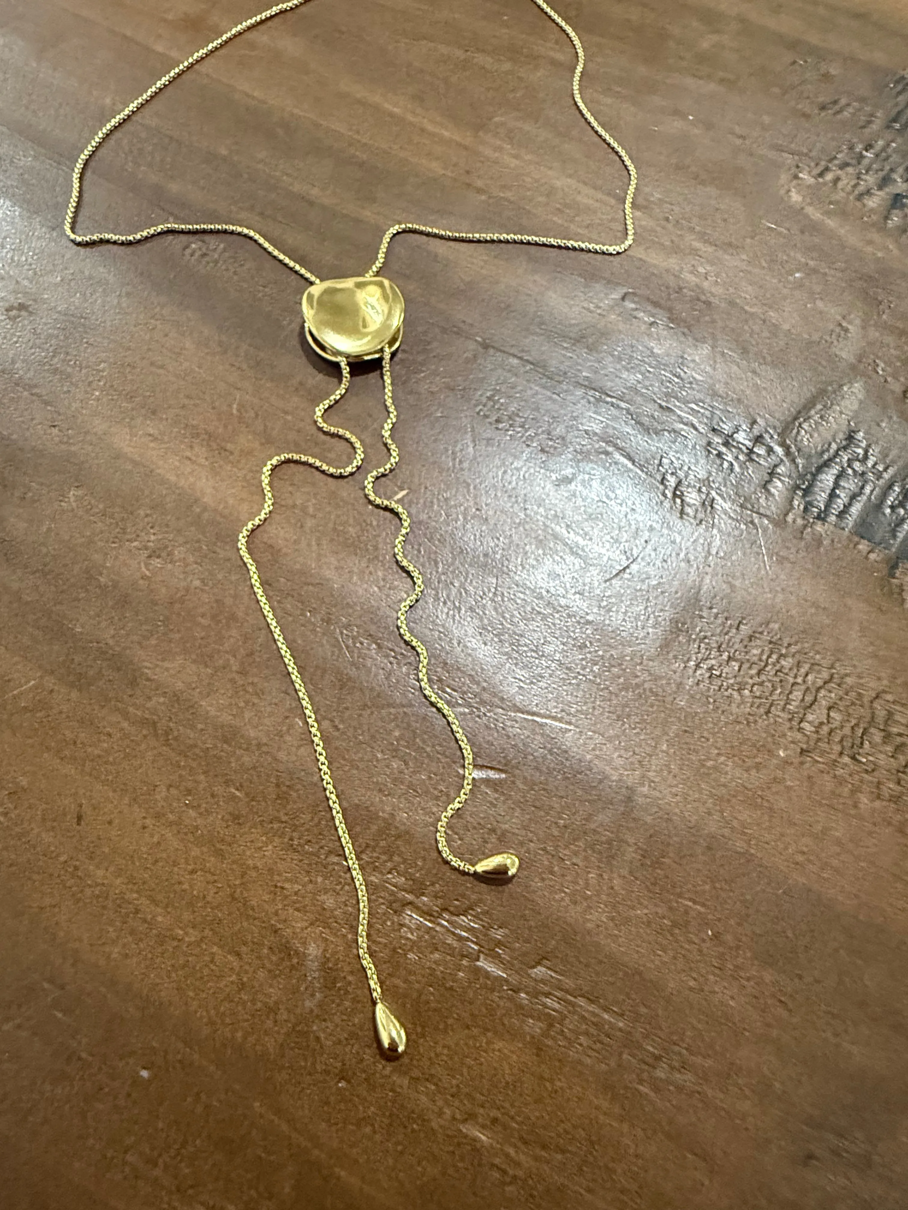 gold disc drop lariat sold by bubs & sass