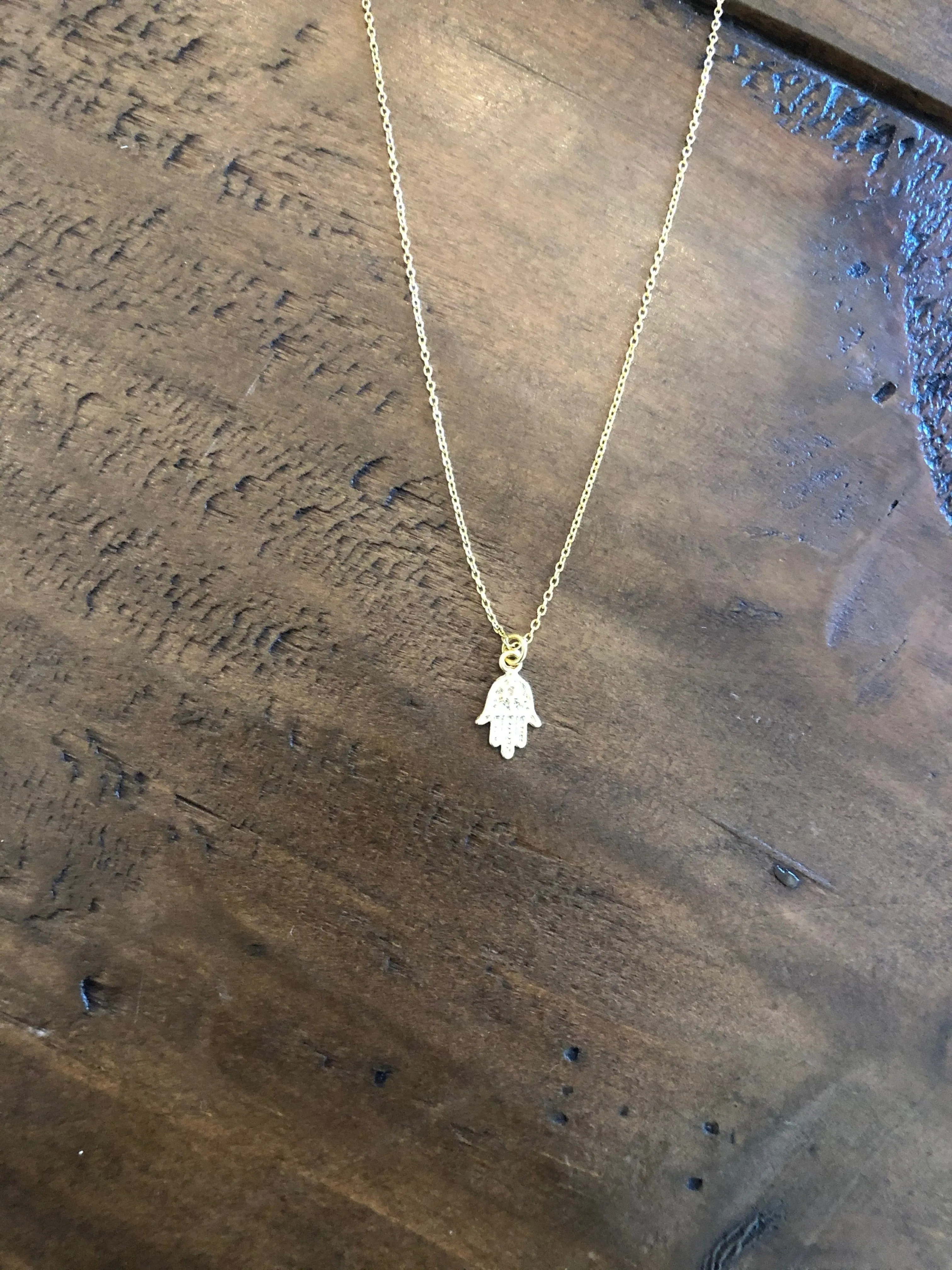 hamsa hand pendant necklace sold by bubs & sass
