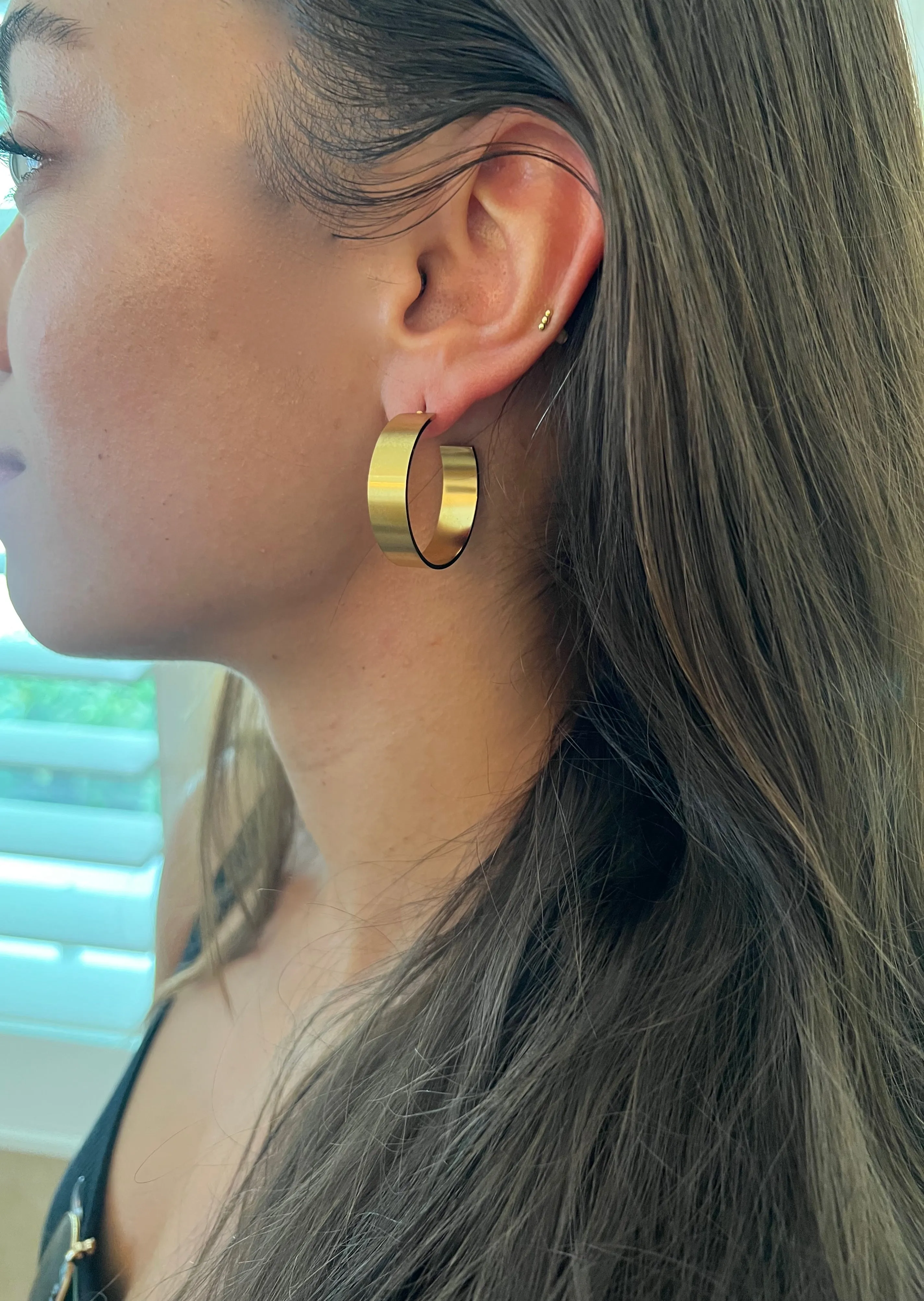 thick matte gold hoop earrings sold by bubs & sass product image thumbnail 3