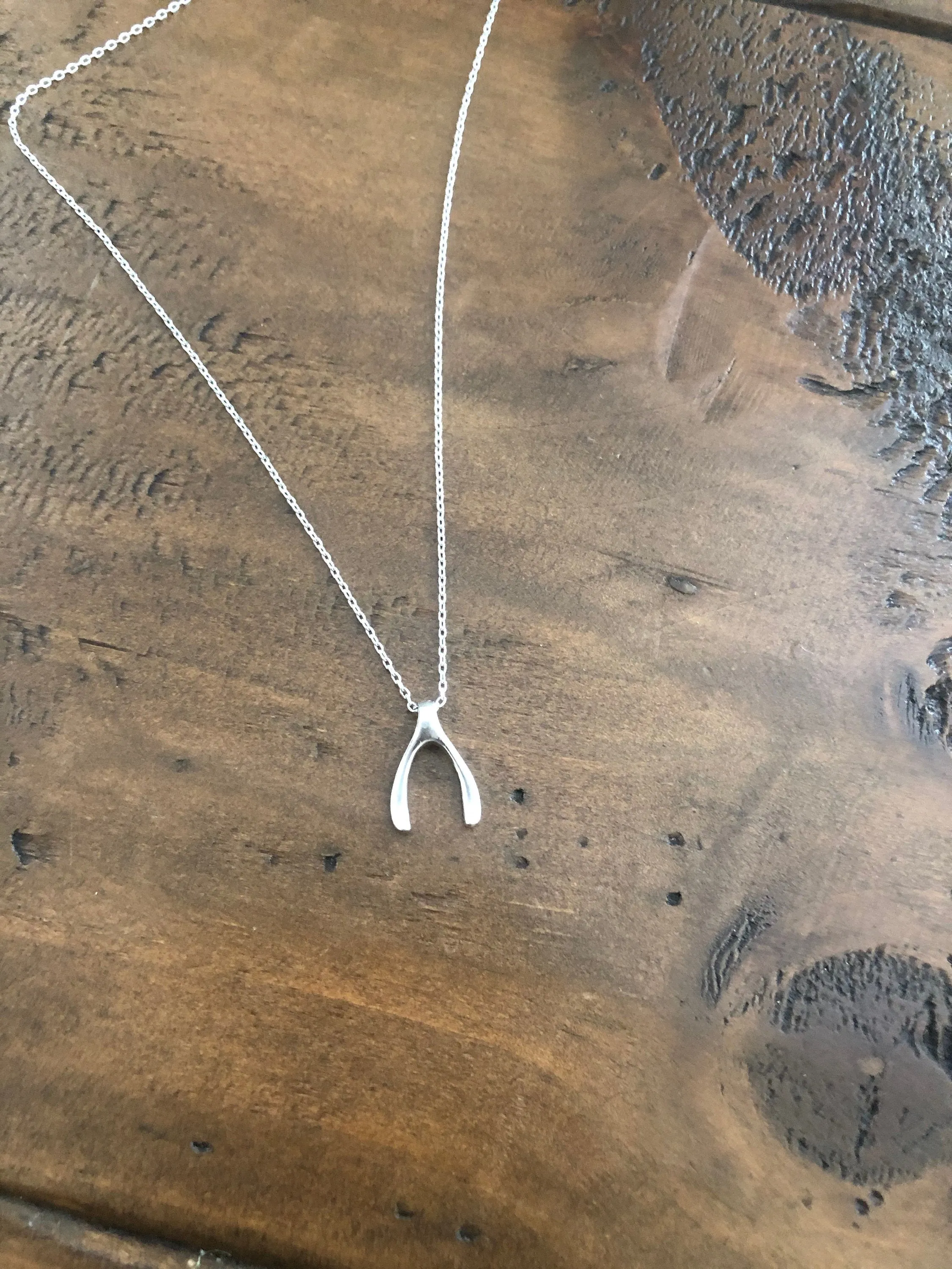 tiny wishbone pendant necklace sold by bubs & sass