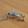Playing Guitar Sterling Silver Skull Pendant sold by GTHIC