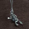 Playing Guitar Sterling Silver Skull Pendant sold by GTHIC