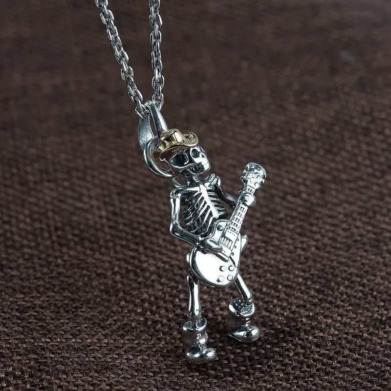 Playing Guitar Sterling Silver Skull Pendant sold by GTHIC