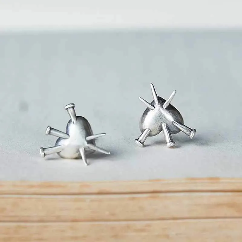 Nailed Piercing Heart Sterling Silver Stud Earrings sold by GTHIC