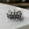 Surrounded Titanium Sterling Silver Skull Ring sold by GTHIC