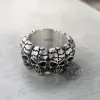 Surrounded Titanium Sterling Silver Skull Ring sold by GTHIC