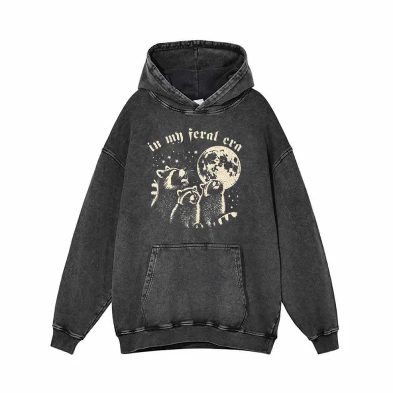 In My Feral Era Raccoon and Moon Vintage Washed Hoodie sold by GTHIC