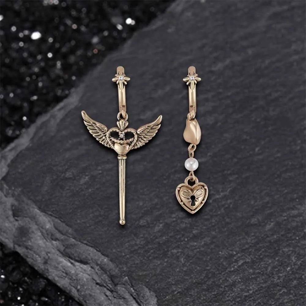 Simple Asymmetrical Cupid Wing Alloy Earrings sold by GTHIC