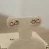 14K Infinity Diamond Studs (Sample Sale) sold by IceLink