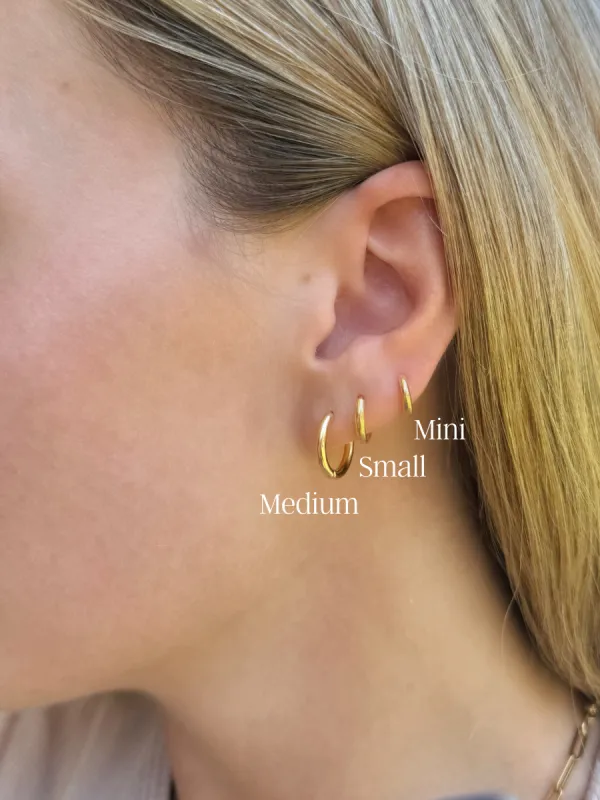 Classic Gold Huggie Earrings sold by LeMel
