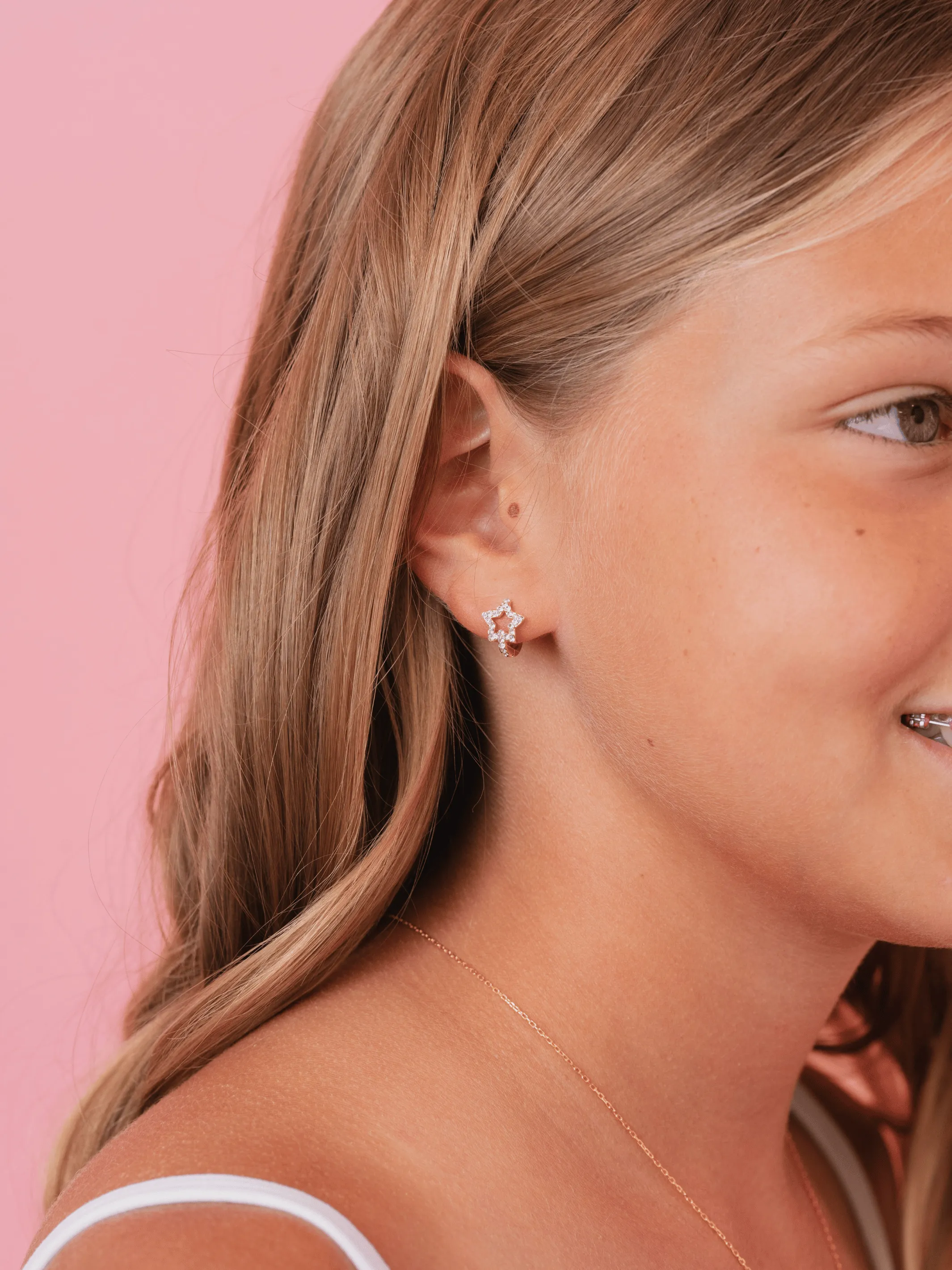 Star CZ Huggie Earrings sold by LeMel