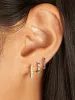 Mini Blue Sapphire and Diamond Huggie 14K sold by LeMel
