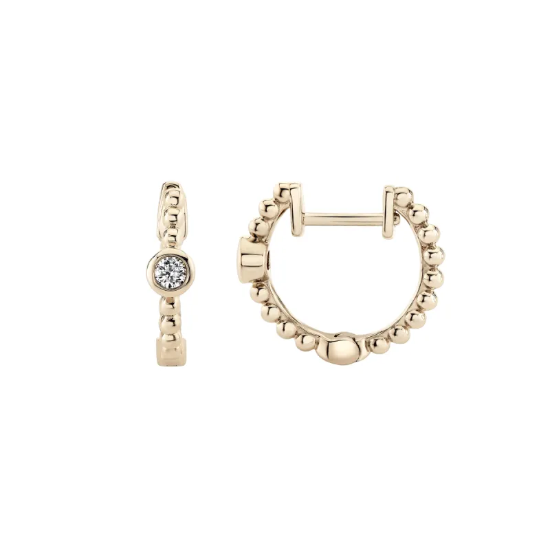 Diamond Dust Huggies sold by Ariel Gordon Jewelry