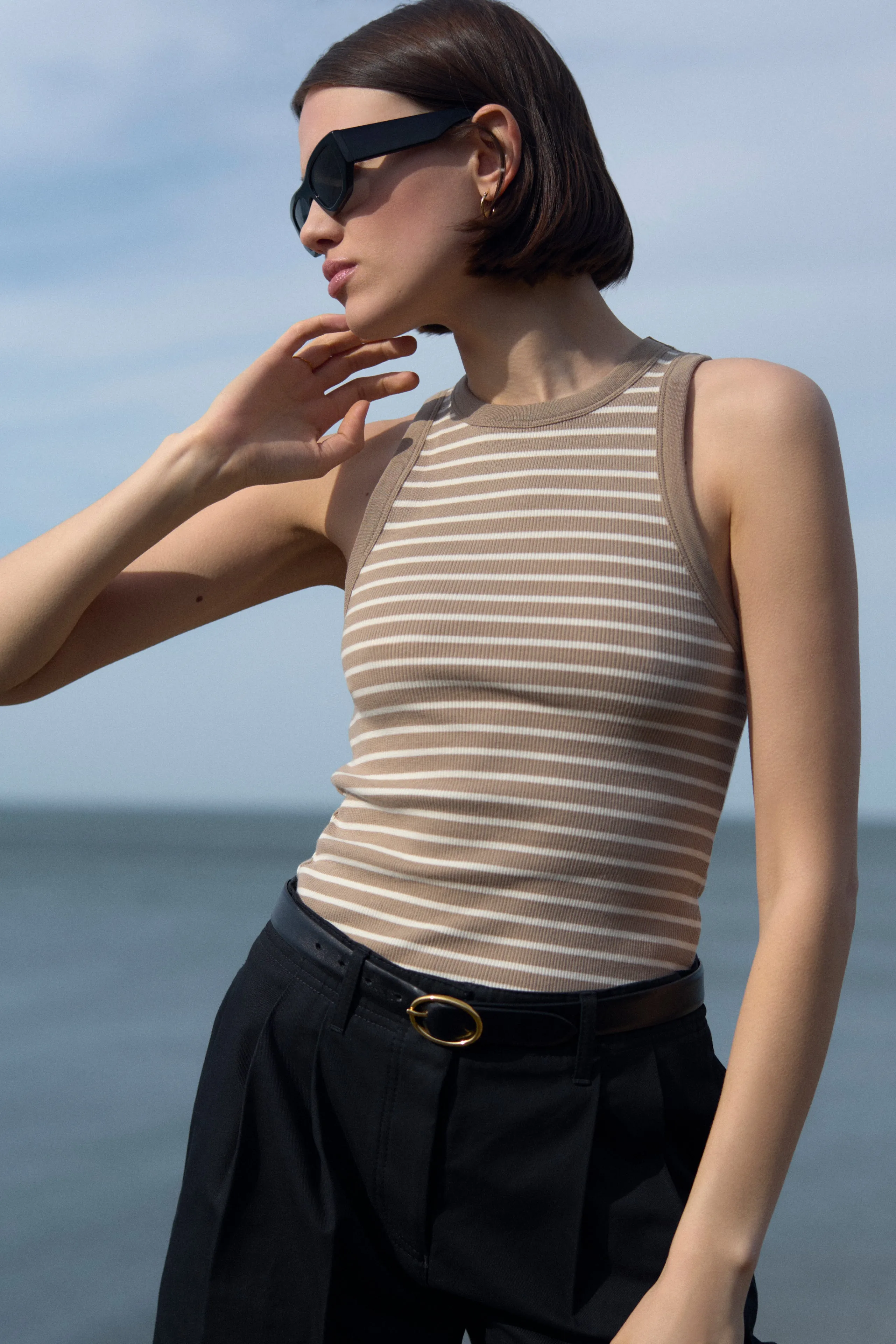 The Not So Basic Tank in Chai Stripe sold by Sold Out NYC