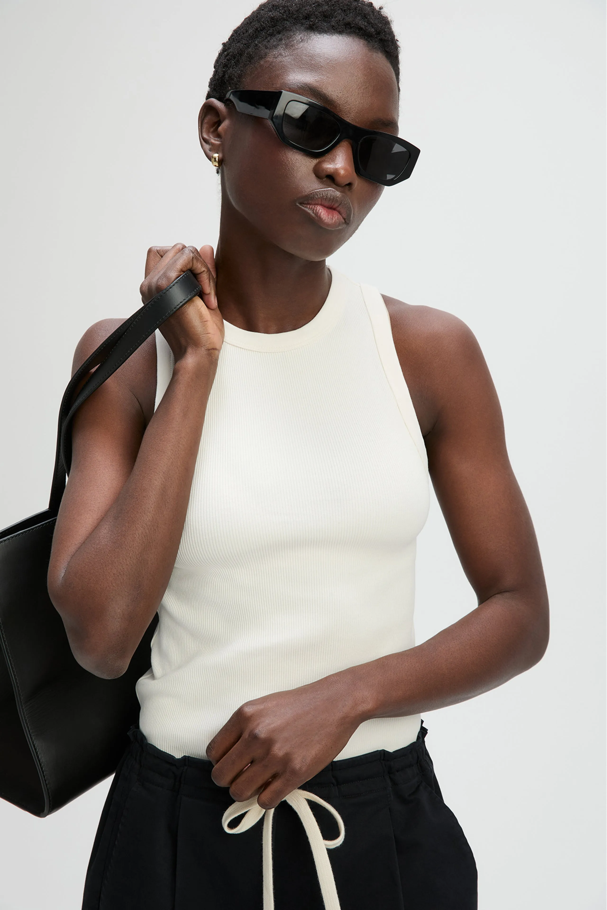 The Not So Basic Tank in Cream sold by Sold Out NYC