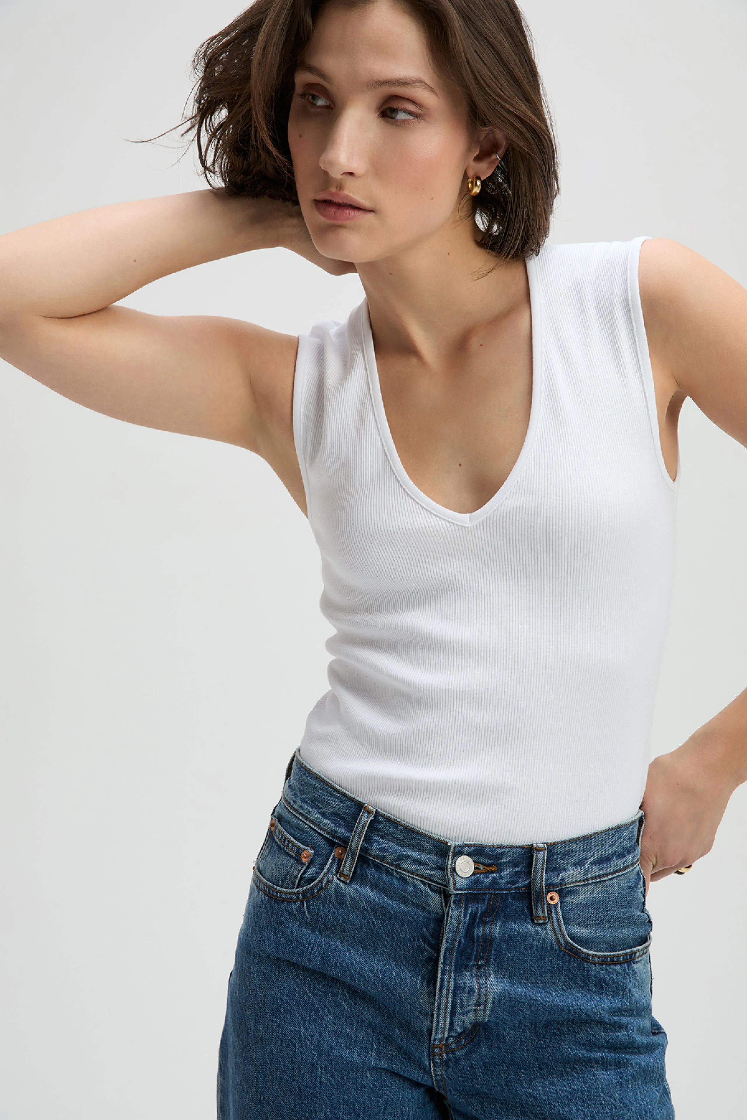The V-Neck Tank in White sold by Sold Out NYC