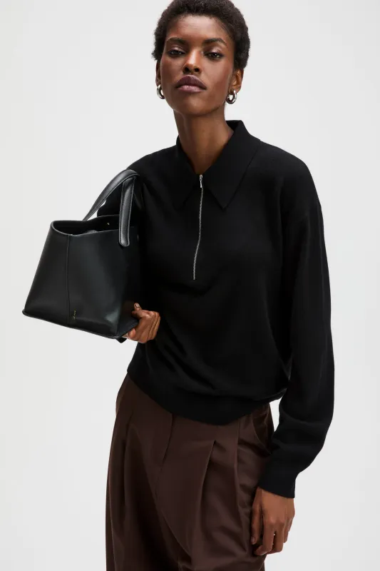 The Cashmere Zip Polo in Black made by Sold Out NYC