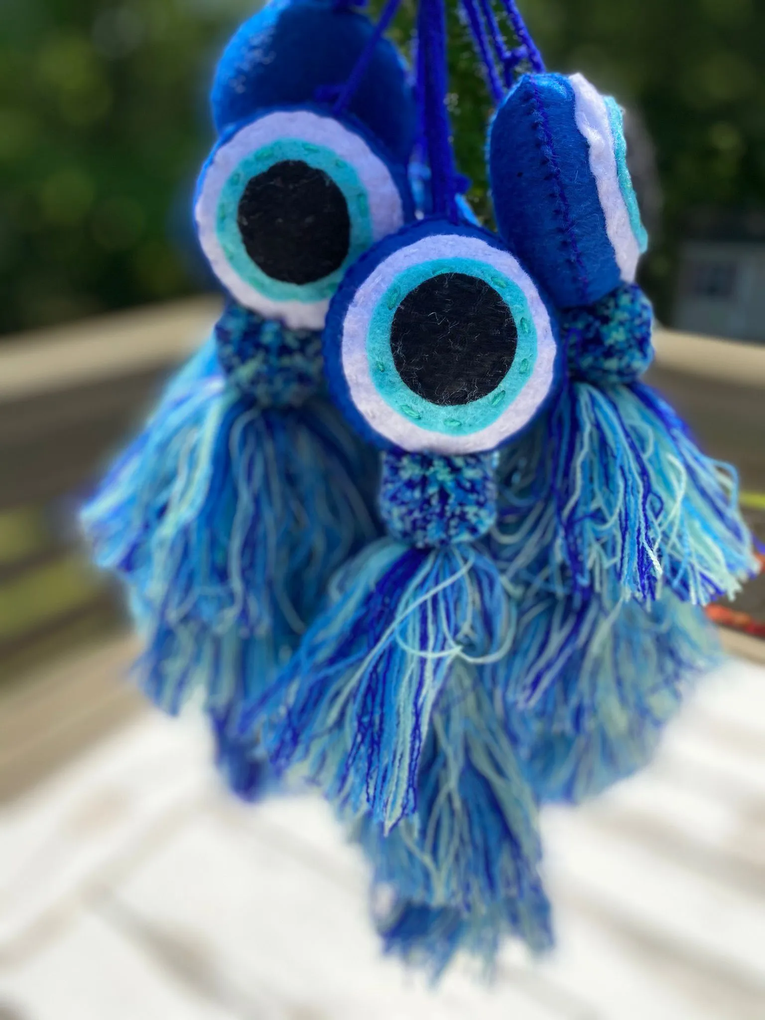Evil Eye Pom sold by Squeeze De Citron