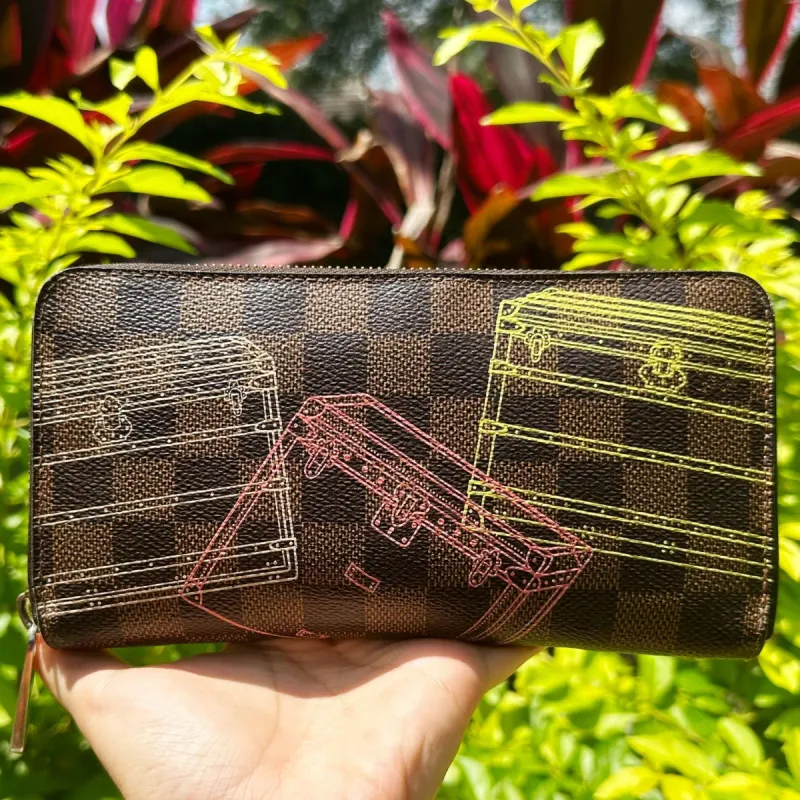 Louis Vuitton N63026 Brown Damier Tiger Illustration Zipper Round Wallet sold by Gaby's Bags
