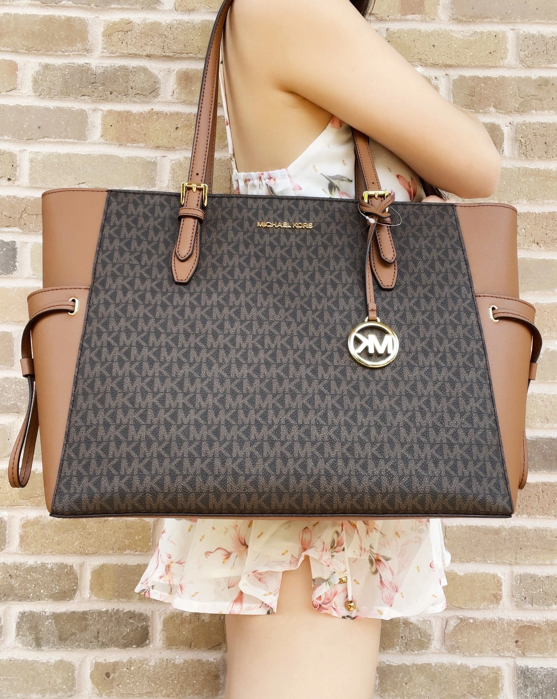 Michael Kors Gilly Large Jet Set Travel Drawstring Tote Brown MK Signature sold by Gaby's Bags