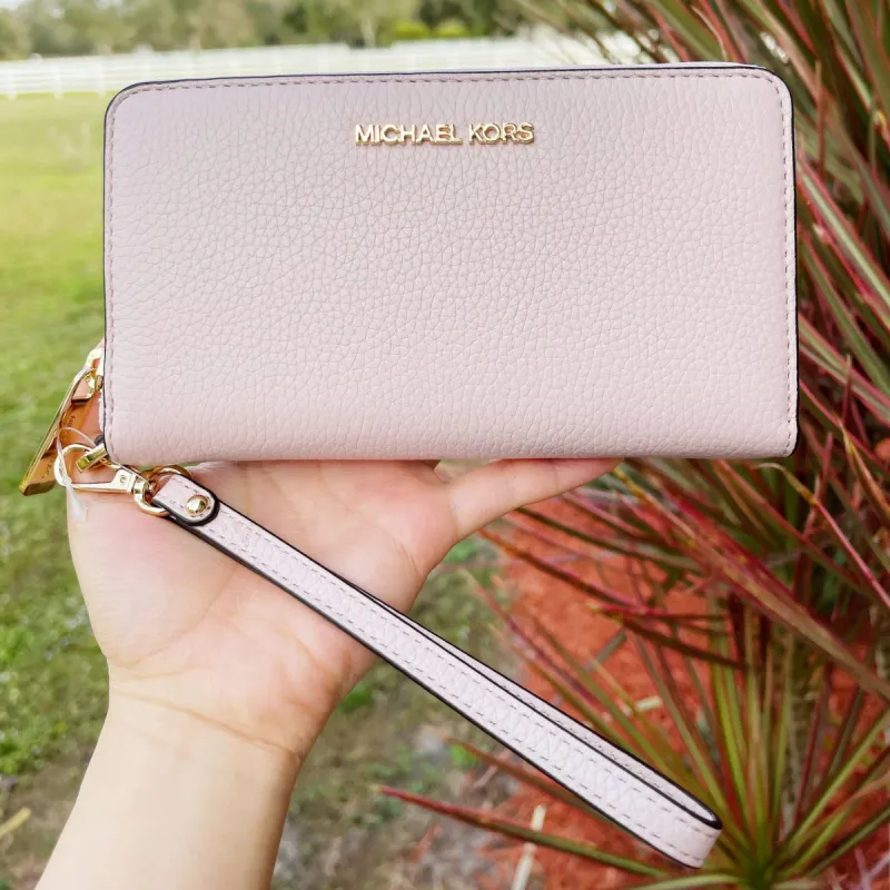 Michael Kors Jet Set Multifunction Phone Wristlet Pebbled Leather Powder Blush sold by Gaby's Bags