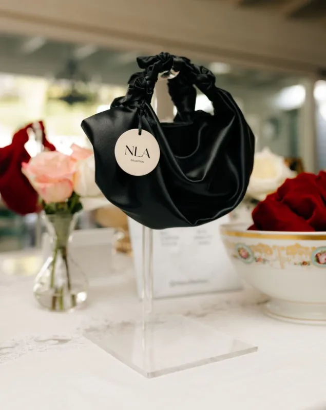 Black NLA Silk Knot Bag sold by Modatrova