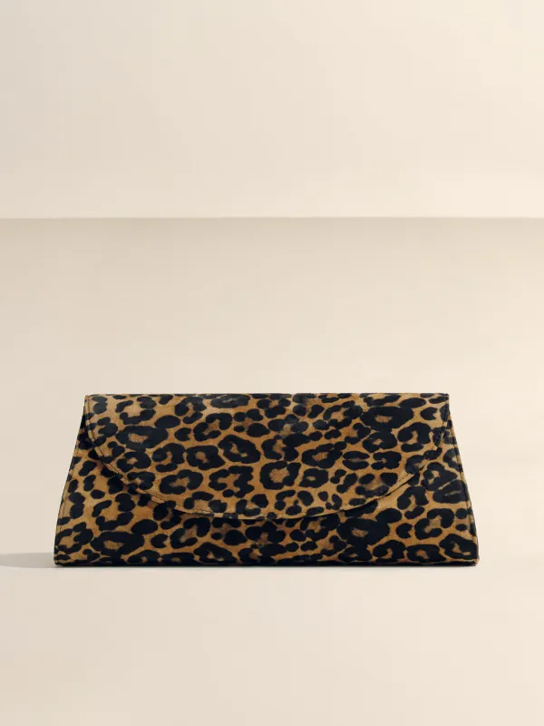 The Opera Clutch in Leopard Suede sold by Hunting Season