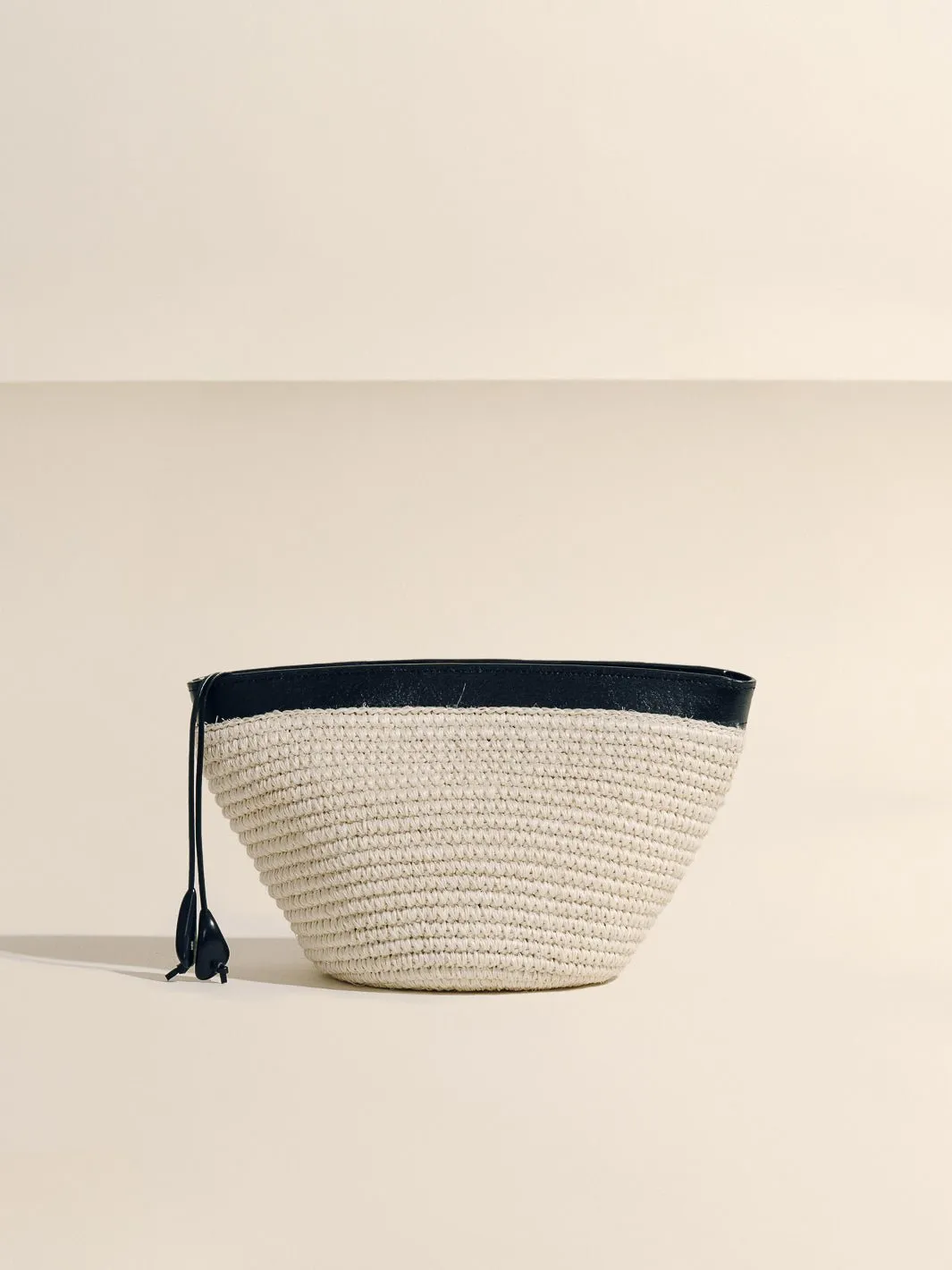 The Medium Zip Clutch in Handwoven Fique sold by Hunting Season