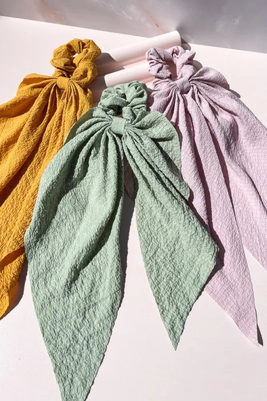 Cascading Bow Scarf Scrunchie sold by Mulberry and Grand