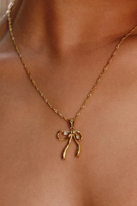 Lilou Bow Charm Necklace sold by Mulberry and Grand