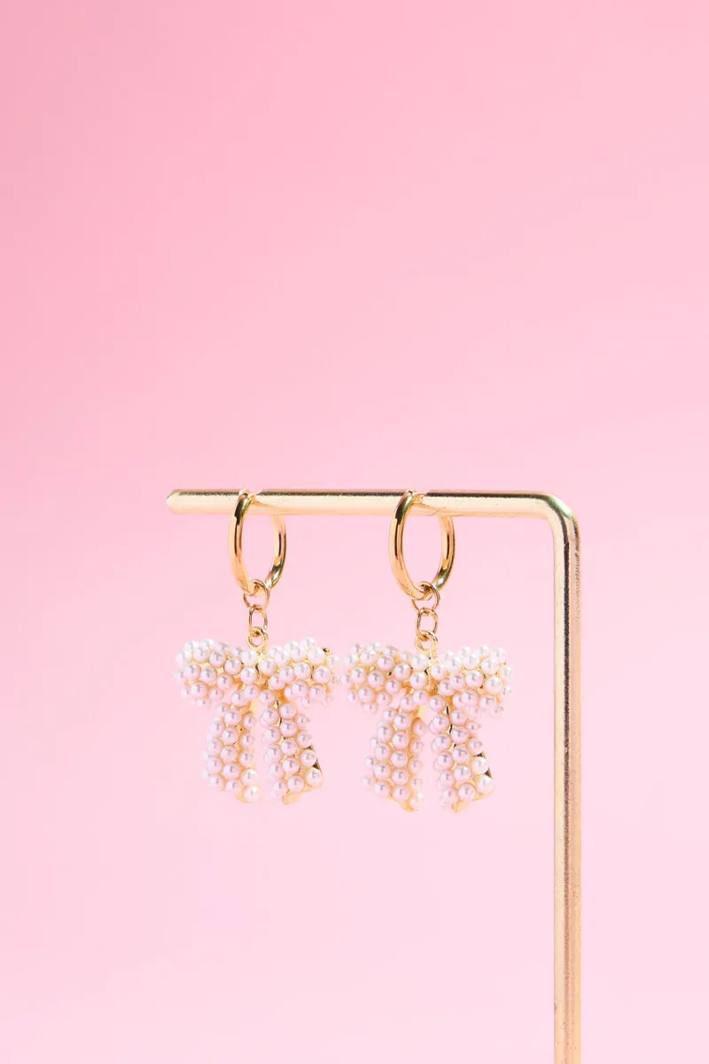 Pearly Bow Charm Dangle Earrings sold by Mulberry and Grand