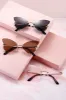 Butterfly Wings Rimless Sunglasses sold by Mulberry and Grand