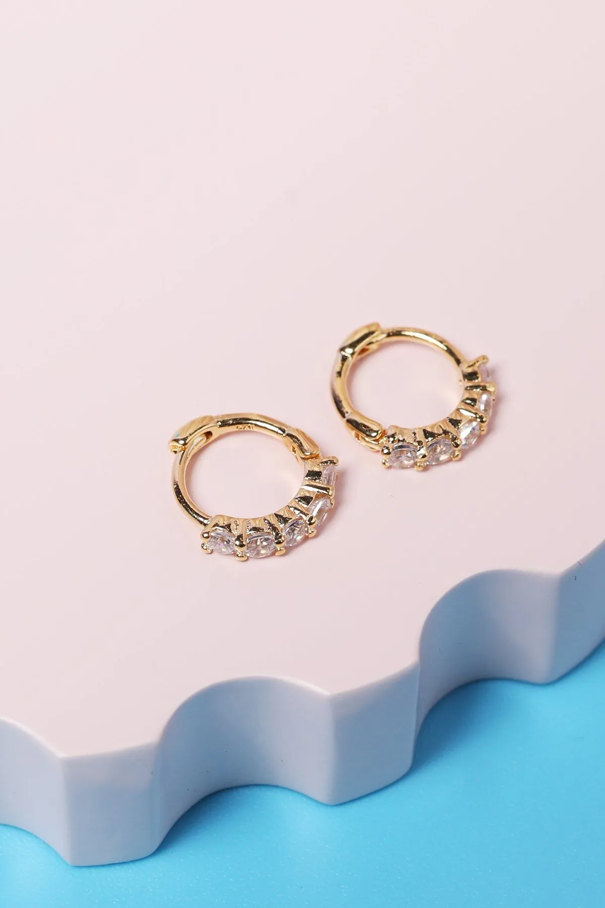 Crystal Sterling Silver Huggie in Gold sold by Mulberry and Grand