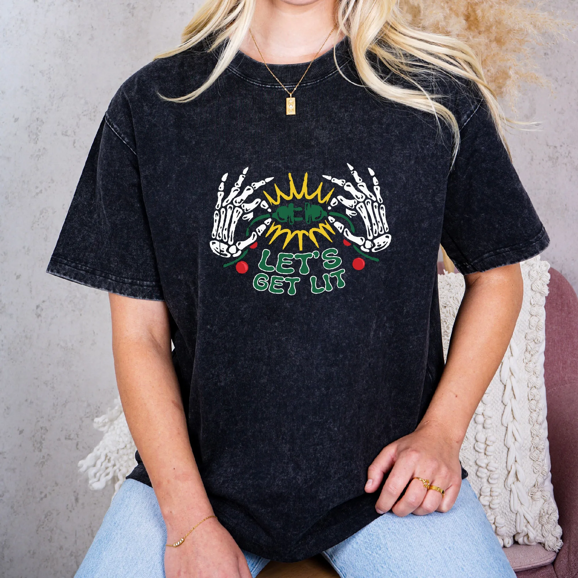 Holiday Cheer: 'Let's Illuminate' Skeleton Hands Christmas Lights Tee sold by Anna-Kaci