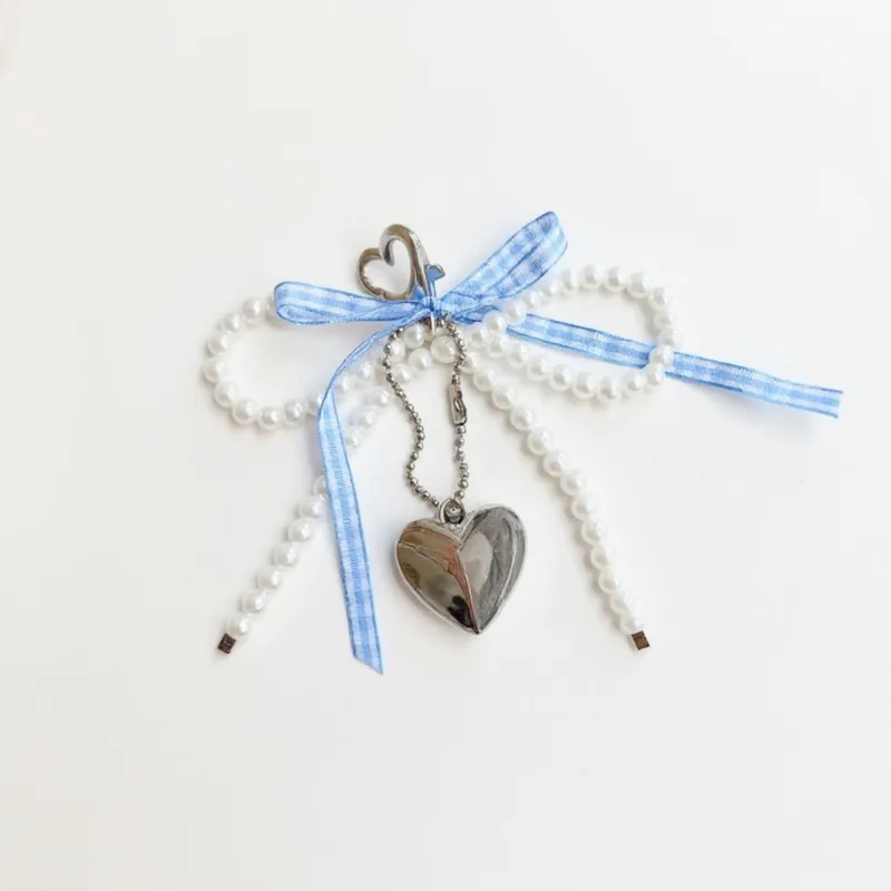 Anna-Kaci Ribbon Pearl Bow Keychain with Silver Heart Charm and Gingham Accent sold by Anna-Kaci