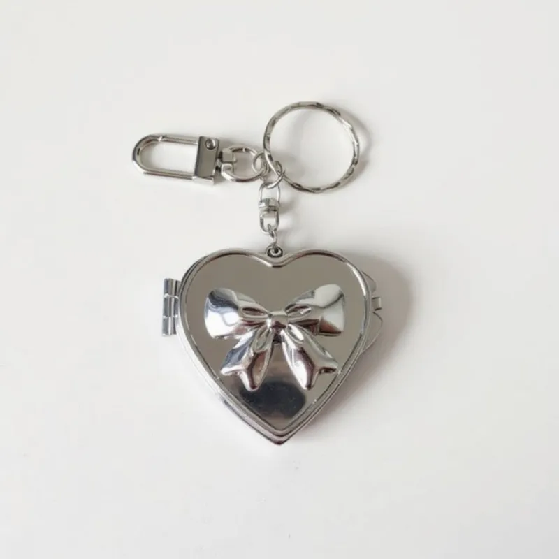 Anna-Kaci Silver Heart Locket Keychain with 3D Bow Detail and Clasp Ring sold by Anna-Kaci