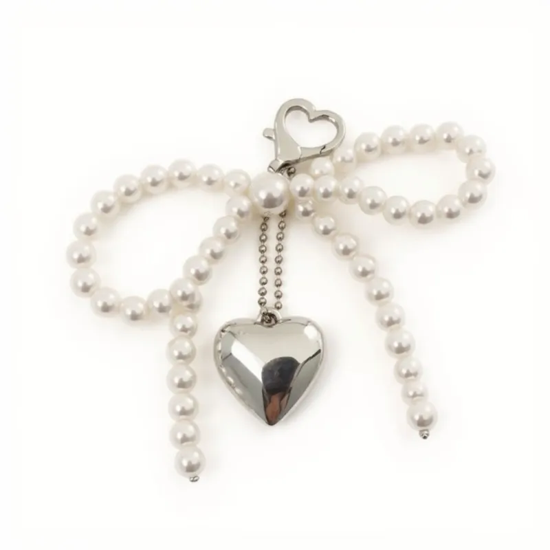 Anna-Kaci Pearl Beaded Bow Keychain with Silver Heart Charm and Heart Clip sold by Anna-Kaci