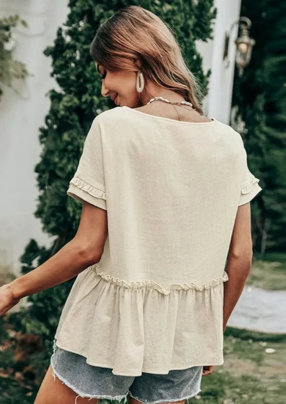 Textured Ruffle Peplum Blouse sold by Anna-Kaci