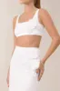 White flower embellished satin crop top sold by Heiress Beverly Hills