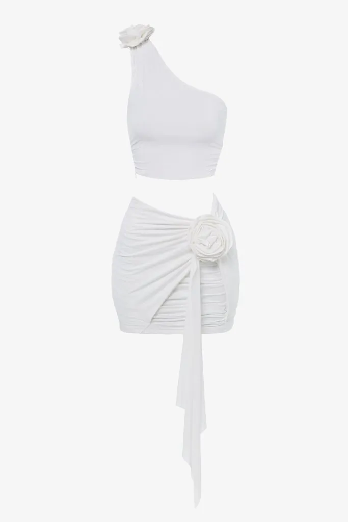 White flower asymmetric crop top sold by Heiress Beverly Hills
