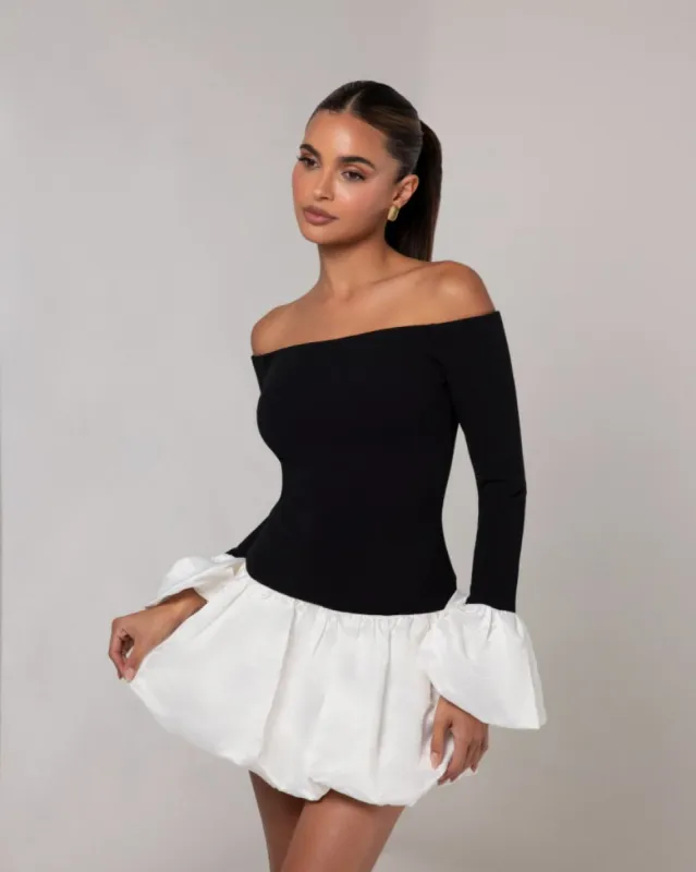 Black off the shoulder white puff sleeve mini dress sold by Heiress Beverly Hills