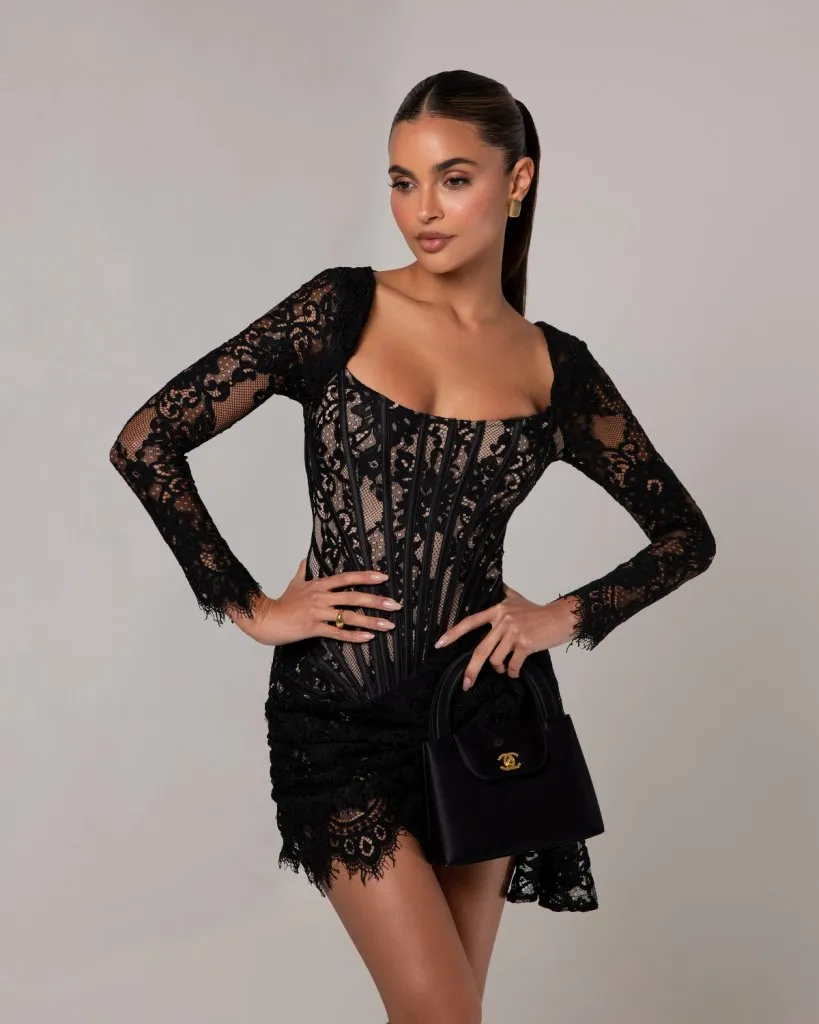 The lace corset long sleeve mini dress sold by Heiress Beverly Hills
