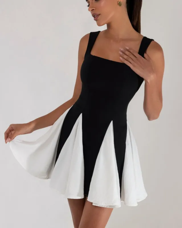 Black colorblock pleated mini dress sold by Heiress Beverly Hills