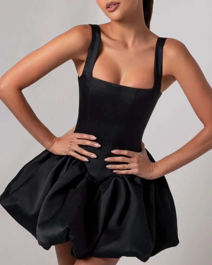 Black corset sheen mini bubble dress sold by Heiress Beverly Hills
