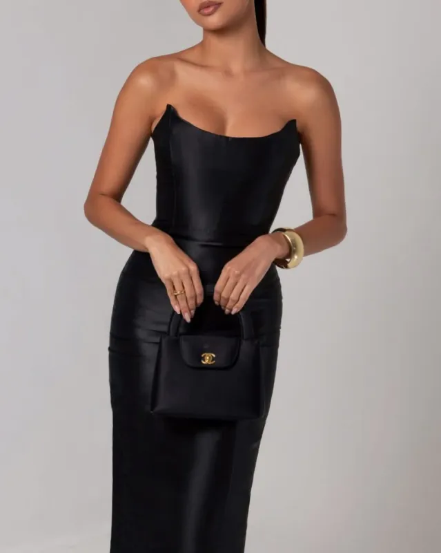 Black strapless sheen corset midi dress sold by Heiress Beverly Hills