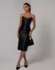 Black strapless sheen corset midi dress sold by Heiress Beverly Hills